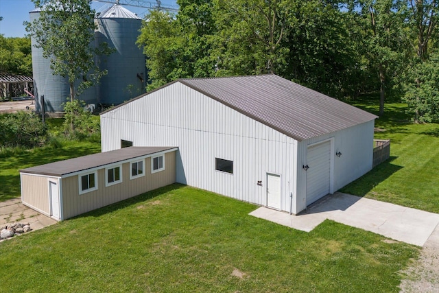 view of outbuilding featuring a yard and a garage