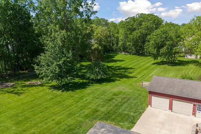 210 E Mcneil St, Corunna, MI 48817 - view of green lawn featuring a garage