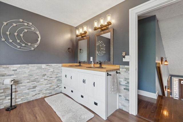 bathroom featuring vanity and hardwood / wood-style flooring