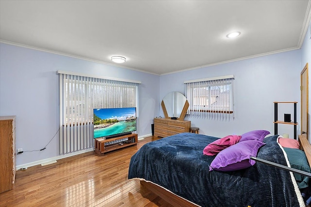 bedroom featuring hardwood / wood-style floors and ornamental molding