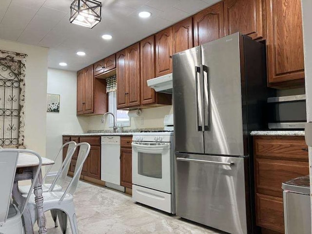 kitchen with white appliances and sink