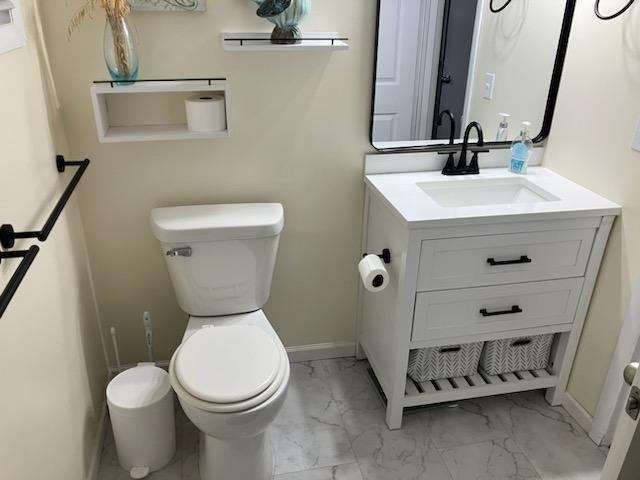 bathroom with vanity and toilet