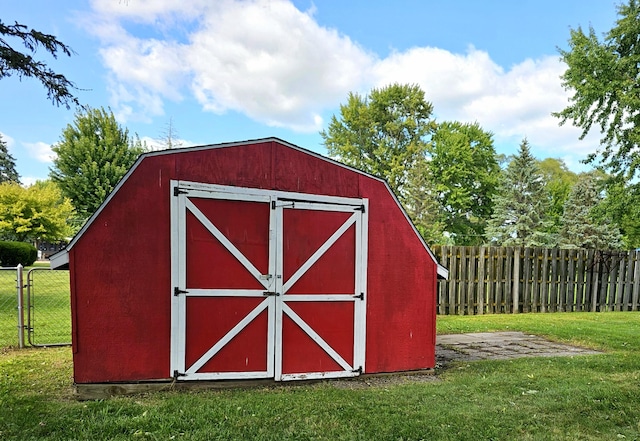 view of outbuilding featuring a yard