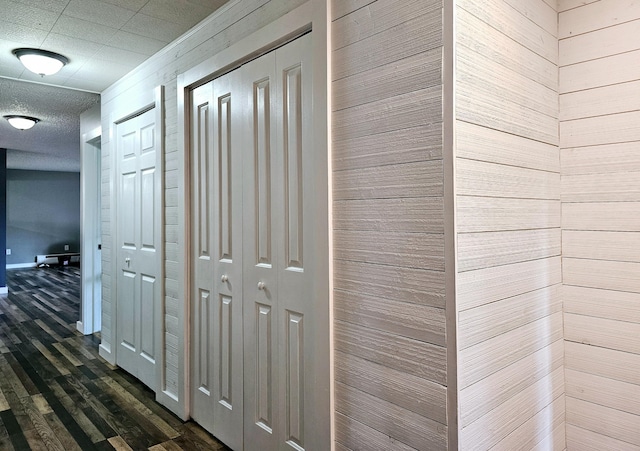 corridor featuring dark wood-type flooring