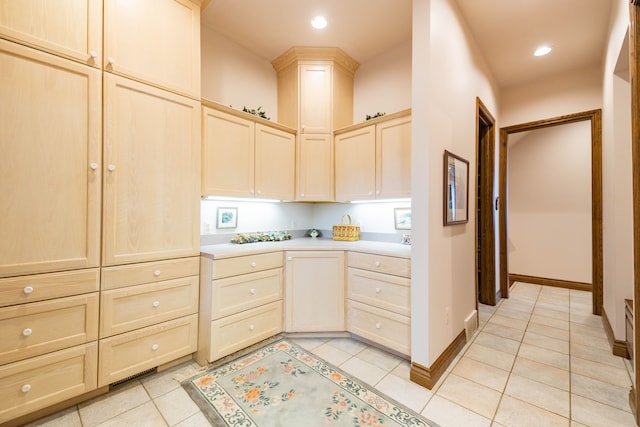 kitchen featuring light brown cabinets and light tile patterned floors