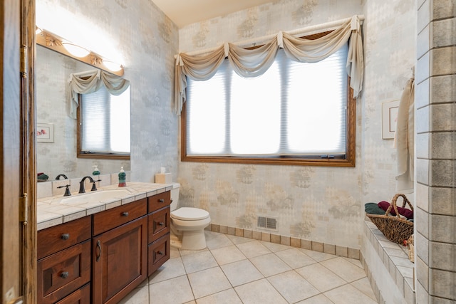 bathroom with tile patterned floors, vanity, and toilet