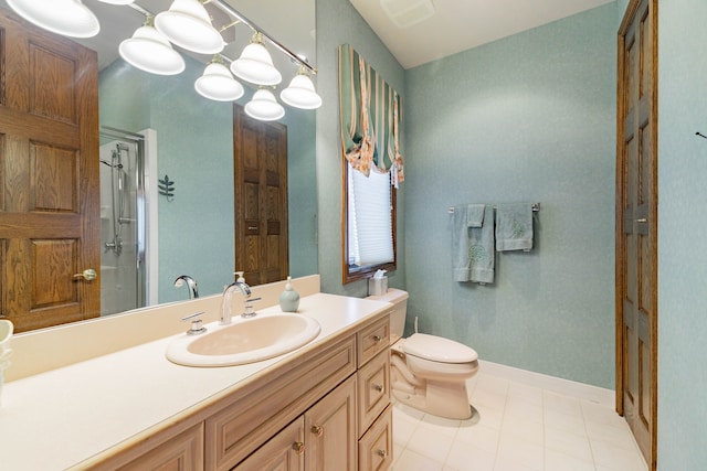 bathroom featuring tile patterned floors, vanity, an enclosed shower, and toilet