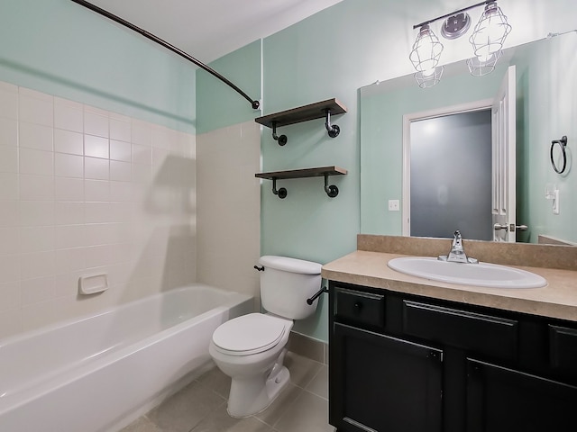 full bathroom featuring tile patterned flooring, vanity, tiled shower / bath combo, and toilet