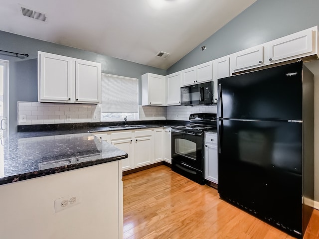 kitchen featuring black appliances, white cabinets, sink, and light hardwood / wood-style flooring