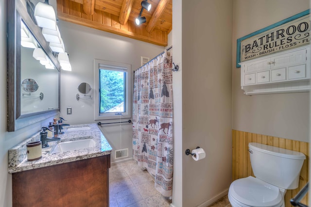 bathroom with vanity, wooden ceiling, a shower with curtain, toilet, and beam ceiling