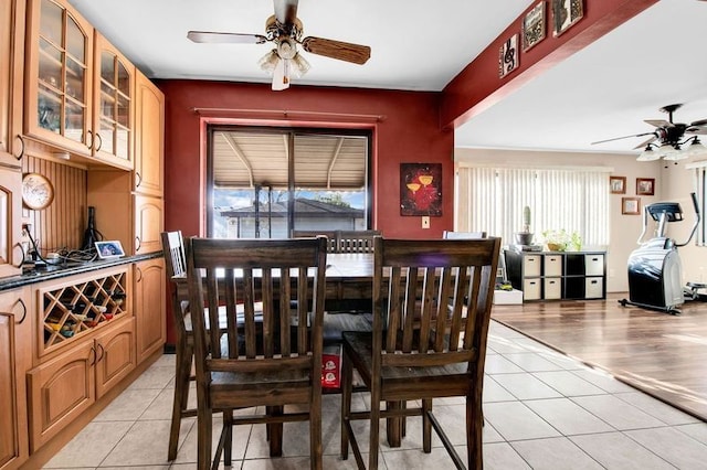 dining area with ceiling fan and light tile patterned floors