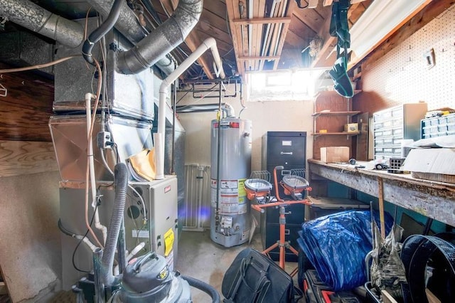 utility room featuring gas water heater