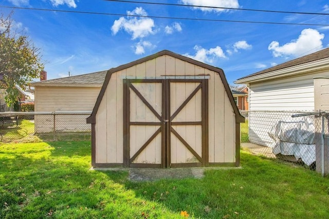 view of outbuilding featuring a yard