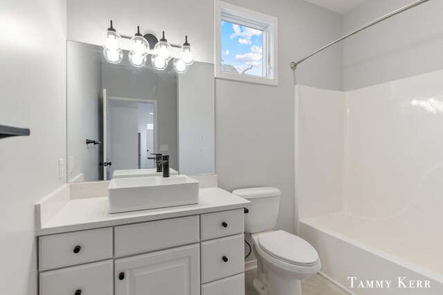 full bathroom featuring vanity, toilet, and bathtub / shower combination