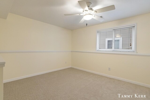 carpeted empty room with ceiling fan