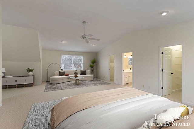 bedroom with light carpet, vaulted ceiling, ensuite bath, and ceiling fan