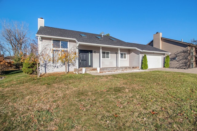 single story home with a garage and a front lawn