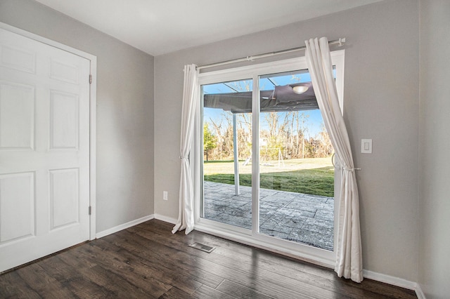 doorway to outside featuring dark hardwood / wood-style floors