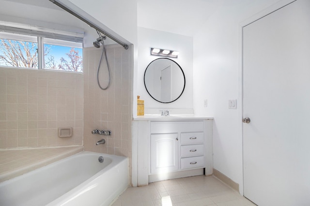 bathroom featuring tile patterned floors, vanity, and tiled shower / bath combo