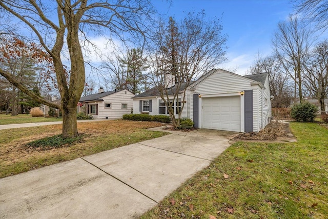 ranch-style house with a front yard and a garage