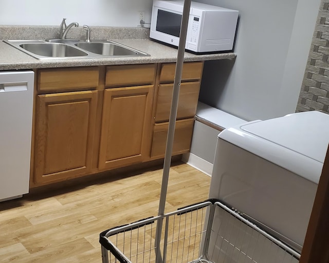 2639 S 3rd St, Niles, MI 49120 - kitchen with dishwasher, sink, and light hardwood / wood-style floors