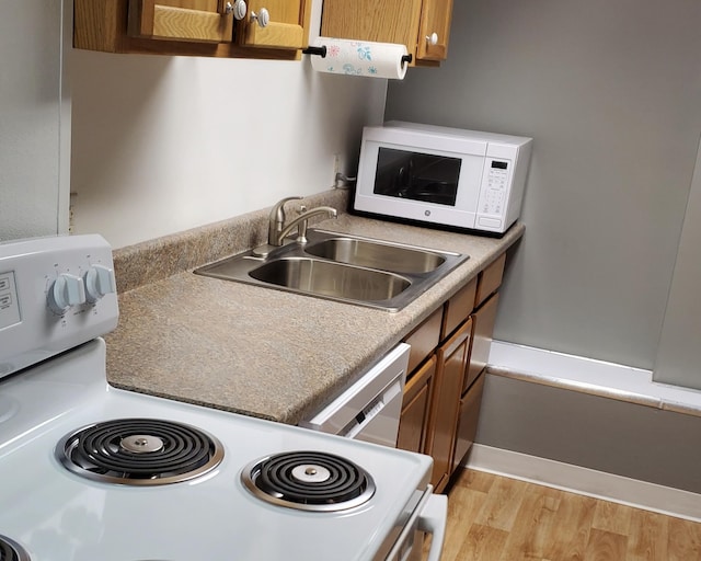 2639 S 3rd St, Niles, MI 49120 - kitchen featuring dishwasher, light hardwood / wood-style floors, electric stove, and sink
