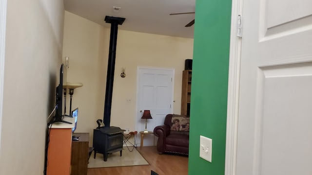 2639 S 3rd St, Niles, MI 49120 - interior space featuring light wood-type flooring, a wood stove, and ceiling fan