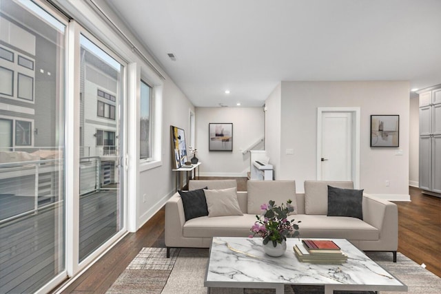 living room featuring dark wood-style floors, recessed lighting, visible vents, stairway, and baseboards