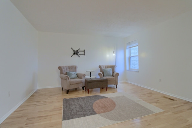 sitting room featuring light hardwood / wood-style flooring