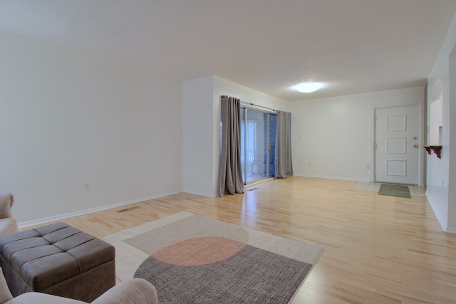 living room with light hardwood / wood-style flooring