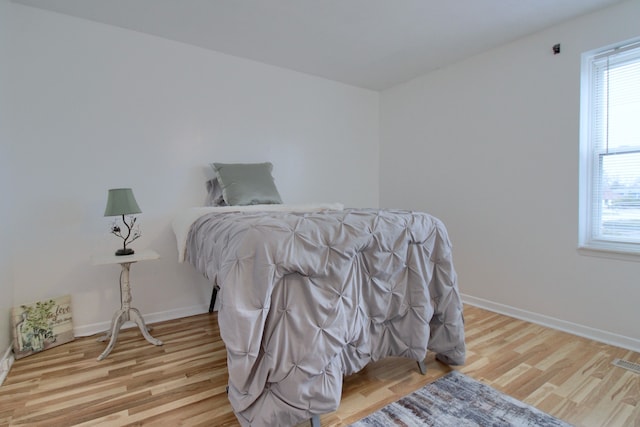 bedroom with light hardwood / wood-style flooring