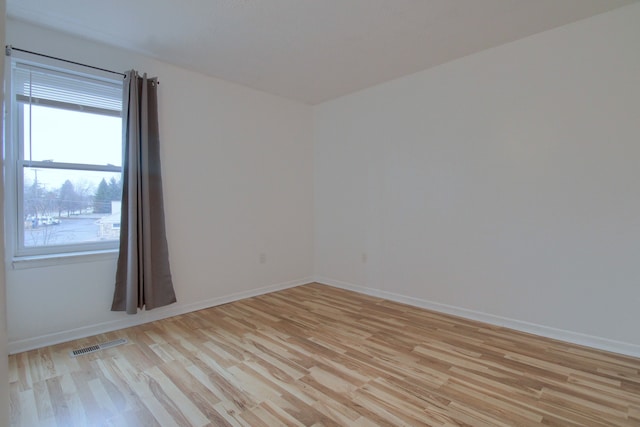 empty room featuring light hardwood / wood-style floors