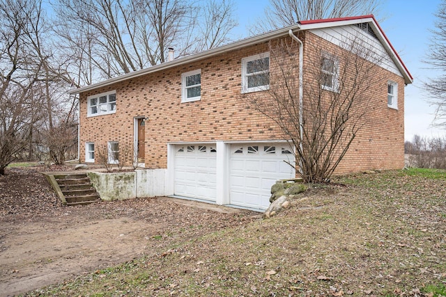 back of property with a garage