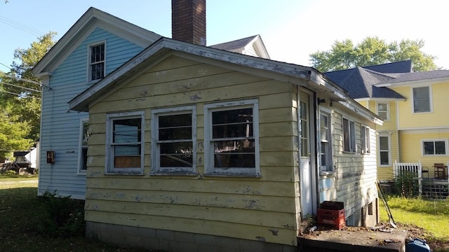 717 W Liberty St, Ann Arbor, MI 48103 - view of side of home with a chimney