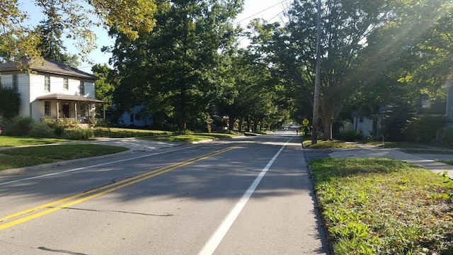 717 W Liberty St, Ann Arbor, MI 48103 - view of asphalt road with sidewalks, traffic signs, and curbs