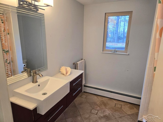 bathroom featuring vanity and baseboard heating