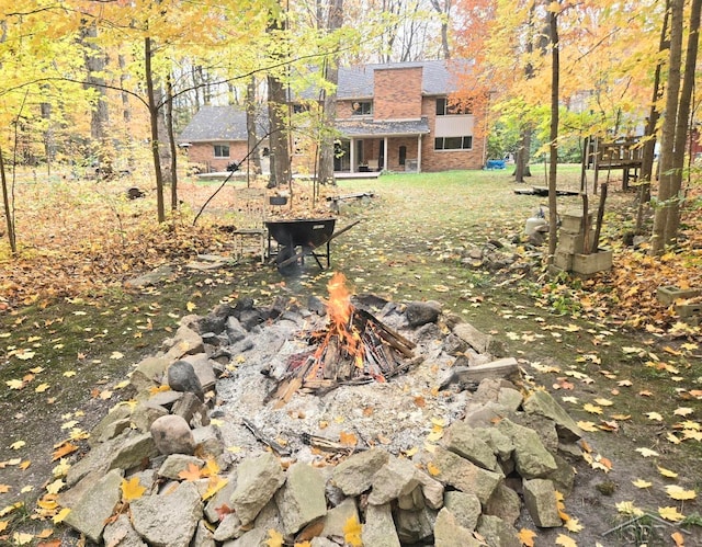 view of yard with a fire pit