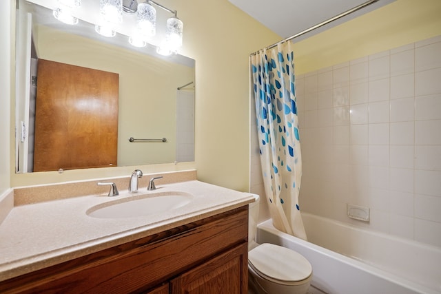 full bathroom featuring vanity, shower / bathtub combination with curtain, and toilet