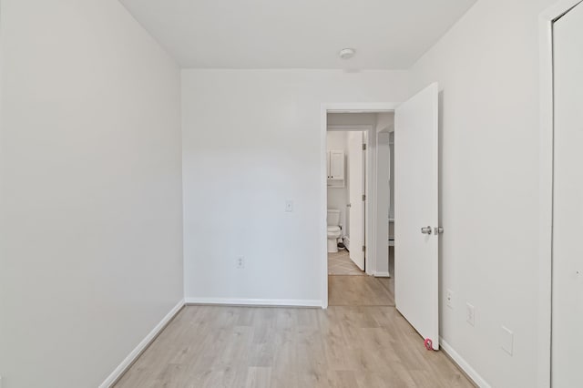 spare room featuring light wood-type flooring