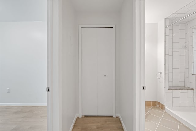 corridor featuring light hardwood / wood-style flooring