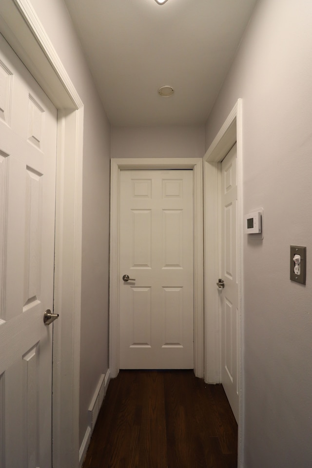 hall with dark hardwood / wood-style flooring