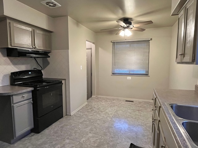 kitchen featuring decorative backsplash, ceiling fan, sink, black electric range, and gray cabinets