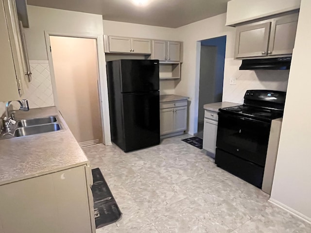 kitchen featuring decorative backsplash, sink, and black appliances