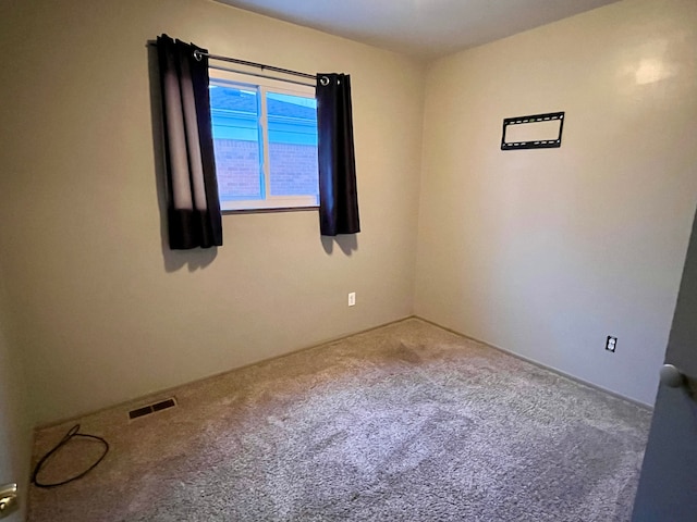 unfurnished room featuring carpet floors