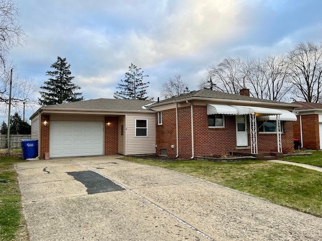 view of front facade with a front yard and a garage