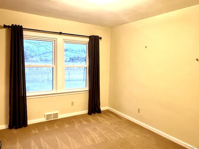 view of carpeted spare room