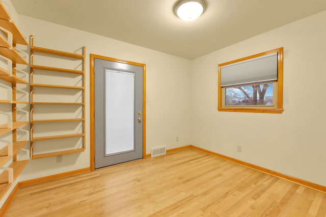 empty room featuring hardwood / wood-style floors