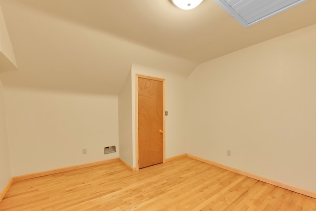 bonus room featuring wood-type flooring and lofted ceiling