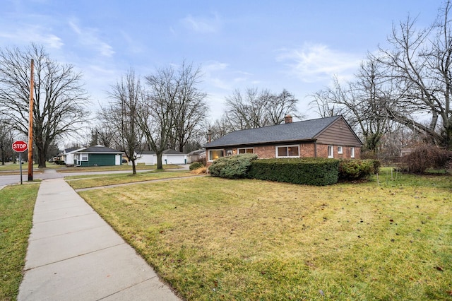 view of home's exterior with a yard