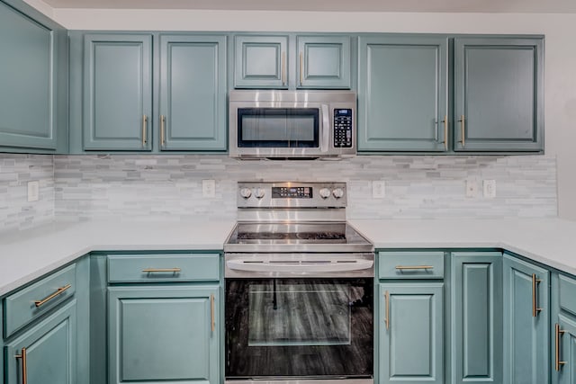 kitchen featuring appliances with stainless steel finishes and tasteful backsplash